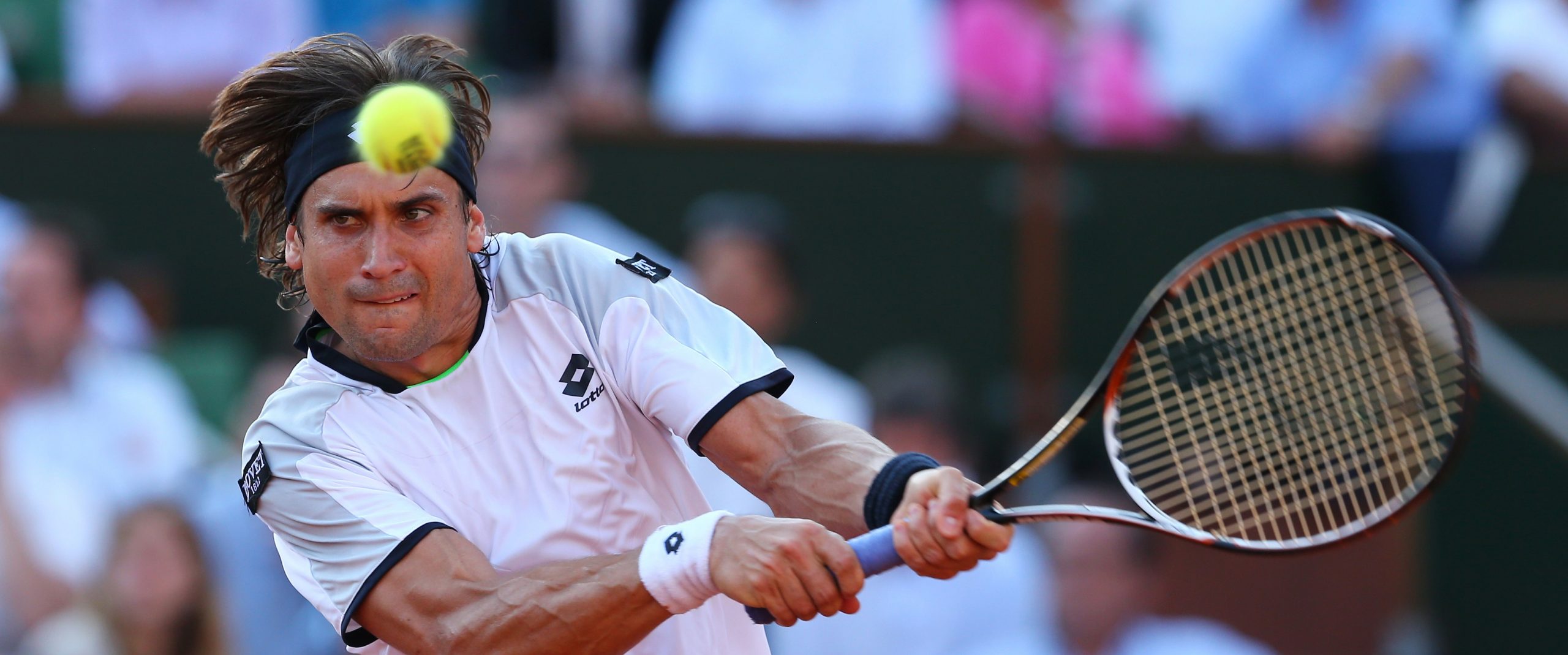 David Ferrer of Spain plays a backhand scaled